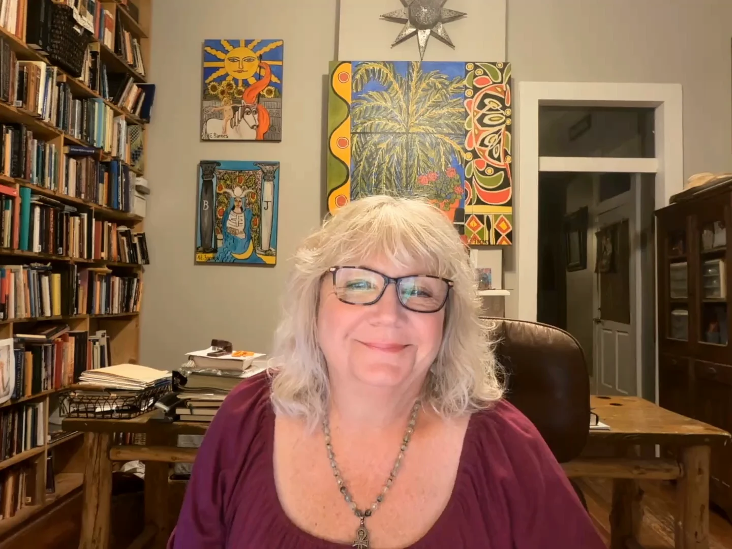 Elie Barnes seated in her study introducing Psychic Circle