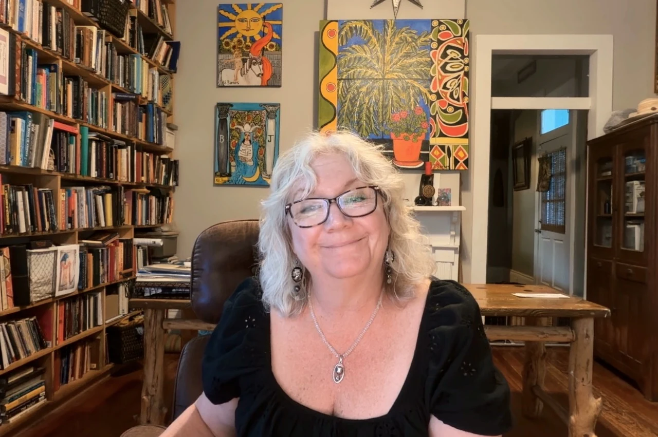 Elie Barnes seated in her studio